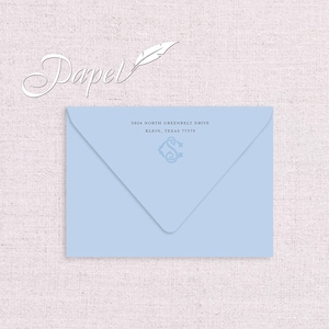 May include: A light blue envelope with a white feather and the word "Papel" in cursive. The address is 5824 North Greenbelt Drive, Klein, Texas 77379.