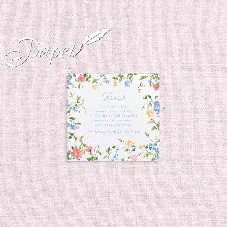 May include: A white card with a floral border and blue text that reads "Details" and "FOR ADDITIONAL WEDDING INFORMATION, INCLUDING ACCOMMODATIONS OPTIONS, PLEASE VISIT OUR WEDDING WEBSITE SYDNEYANDCHARLES.COM".