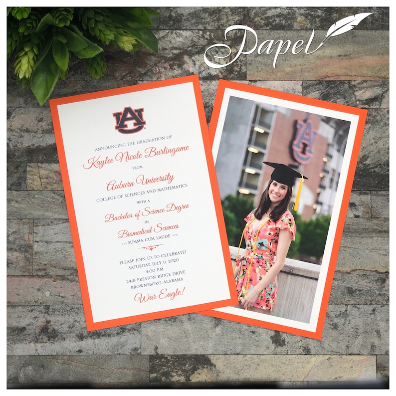 May include: Graduation announcement with an orange border. The invitation includes the graduate's name, degree, and event details. A photo of the graduate in a cap and gown is on the right. The text reads "War Eagle!"