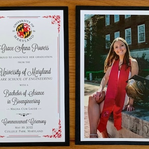 May include: Two framed images. The left frame contains a graduation certificate from the University of Maryland, with the graduate's name and degree details. The right frame shows a photo of a smiling graduate wearing a red sash.