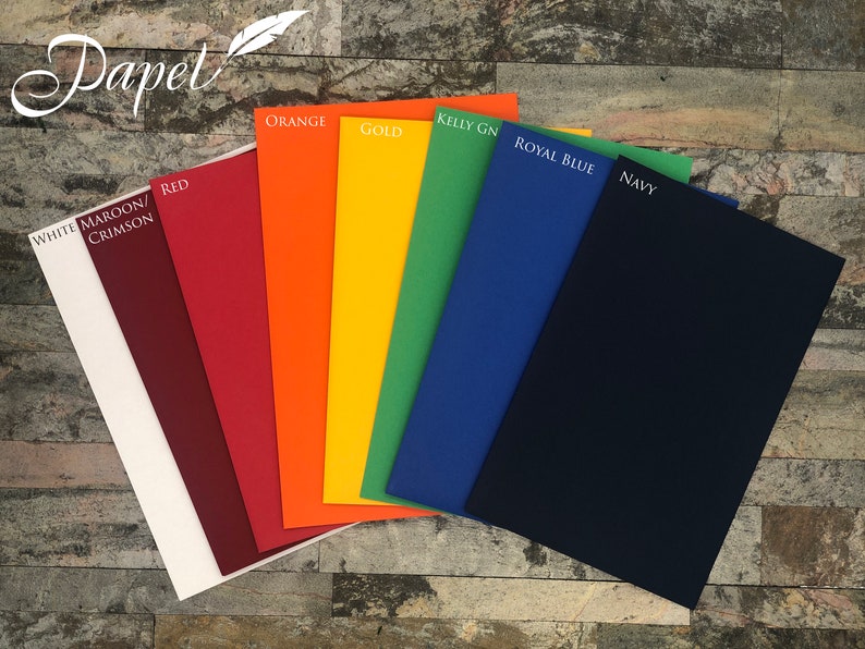 May include: A collection of colorful paper sheets, including white, maroon, red, orange, gold, green, royal blue, and navy. Each sheet is labeled with its color name. The word "Papel" is written in cursive at the top left.