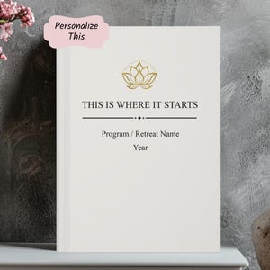 May include: A white journal with the text "THIS IS WHERE IT STARTS" and a gold lotus flower design. The journal includes space for a program or retreat name and the year. A pink label in the upper left corner says "Personalize This".