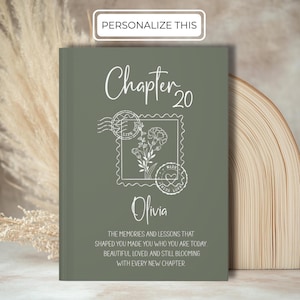 May include: A personalized sage green journal with the text "Chapter 20" and the name "Olivia". The cover features a floral stamp design and the words "Personalize This". The journal includes inspirational text about memories and lessons.