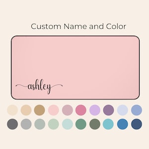 May include: A pink rectangle with a black border and the word "ashley" written in cursive. Below the rectangle are 20 color swatches in various shades of beige, pink, purple, blue, gray, and green.