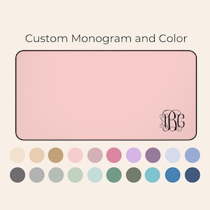 May include: A pink rectangle with a black monogram "B.C." in the bottom right corner. Below the rectangle are 20 color swatches in various shades of beige, gray, green, blue, and purple.