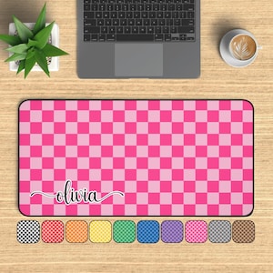 May include: Pink and white checkered mouse pad with the name "olivia" written in cursive.
