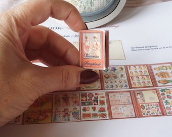 May include: A miniature book titled "Victorian Scrapbook" with a red cover and a picture of two women in Victorian clothing on the front.