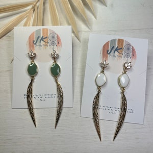 Golden feather dangle earrings