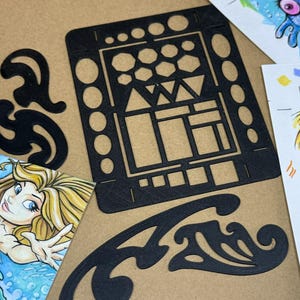 May include: Black plastic templates and illustrations of mermaids and a blue creature. The templates have various geometric shapes and curved designs. The illustrations are colorful and detailed, with the artist's signature in the corner.