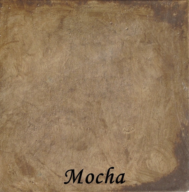 May include: A close-up of a textured, brown surface with the word "Mocha" written in black cursive.