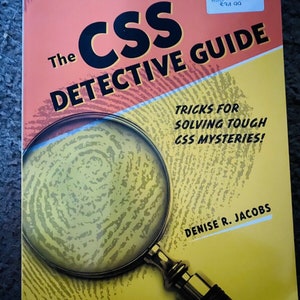 May include: The CSS Detective Guide book cover features a magnifying glass over a fingerprint pattern. The book title is "The CSS Detective Guide" and the subtitle is "Tricks for Solving Tough CSS Mysteries!" The author is Denise R. Jacobs.