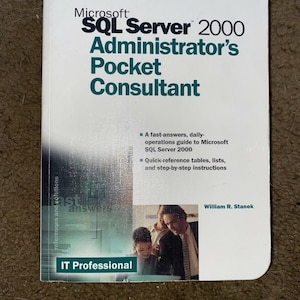 May include: A white book with a blue and green cover. The title is "Microsoft SQL Server 2000 Administrator's Pocket Consultant". The book is part of the IT Professional series. The author is William R. Stanek.