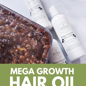 May include: White bottles of Mega Growth Hair Oil with a clear container of herbal ingredients. The bottles have black text and a logo. The image also includes the text "Mega Growth Hair Oil Herbal Infused."