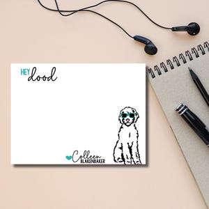 May include: White card with the text "HEY dood" in blue at the top. A black and white illustration of a dog wearing sunglasses is in the bottom right corner. The text "Colleen BLAKENBAKER" is in blue at the bottom left corner.