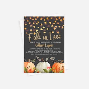 May include: Fall in Love bridal shower invitation with a dark gray background and gold glitter text. The invitation features a watercolor illustration of pumpkins and fall leaves. The text includes the date, time, location, and RSVP information.