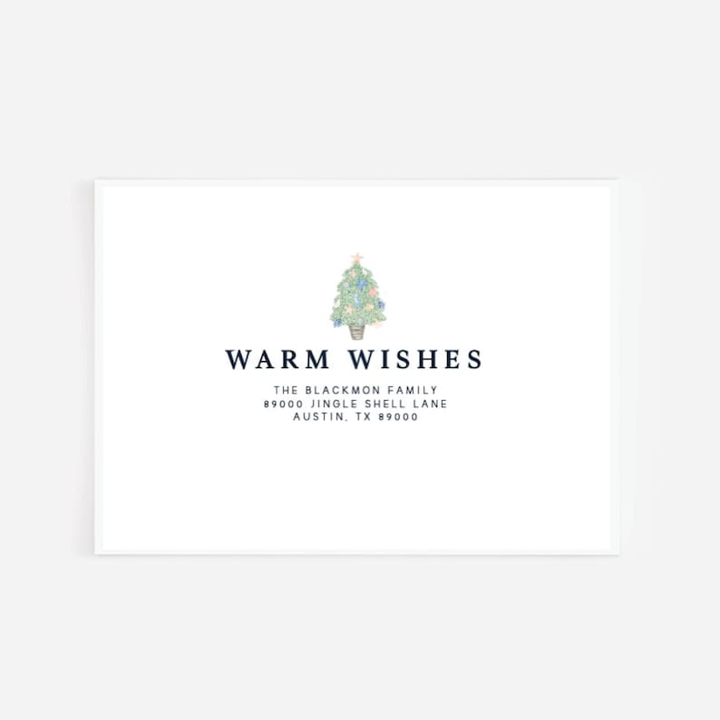 May include: A white card with the text "WARM WISHES" in navy blue. A watercolor illustration of a Christmas tree is above the text. Below the text is the family name and address.