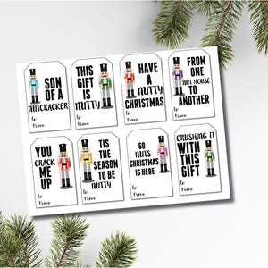 May include: Set of ten printable Christmas gift tags featuring a nutcracker design and a festive message. The tags are white with black text and colorful nutcracker illustrations.
