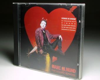 May include: CD case for Marc Almond's album, "The Willing Sinners." The cover art shows a person against a red heart. Text includes "Vermin in Ermine" and song titles. The case is in a clear plastic sleeve. The CD is enhanced with videos.