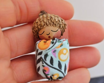 Little Acorn Baby Doll Swaddled in a Sky Blue Print Blanket - 2 Inch Mini Newborn with Medium Brown Skin Tone - Gift Boxed for Mothers Day