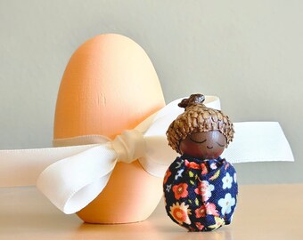 Mini Acorn Baby Doll in Painted Wood Egg - Dark Brown Skin Tone - Two Inch Doll - Navy and Peach Fabric Print - Easter Basket Surprise Gift