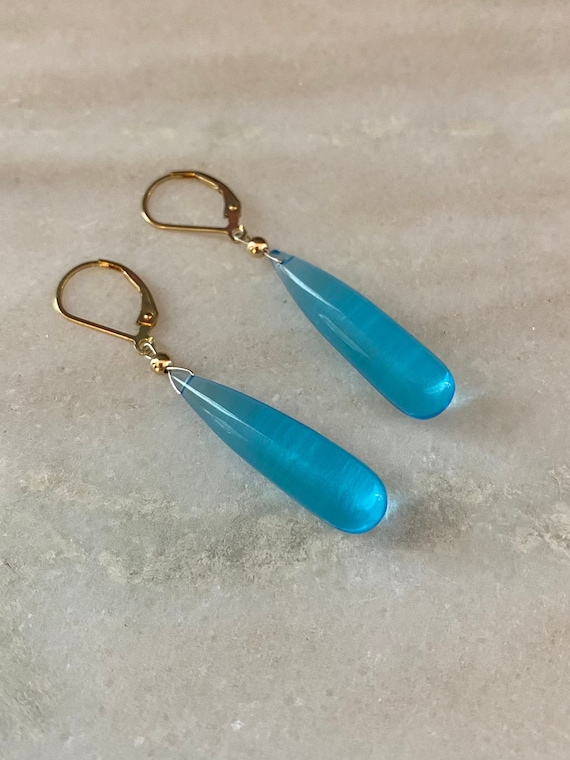 Blue Topaz dangle earrings on 14k yellow gold filled leverbacks. *Rain Drop collection