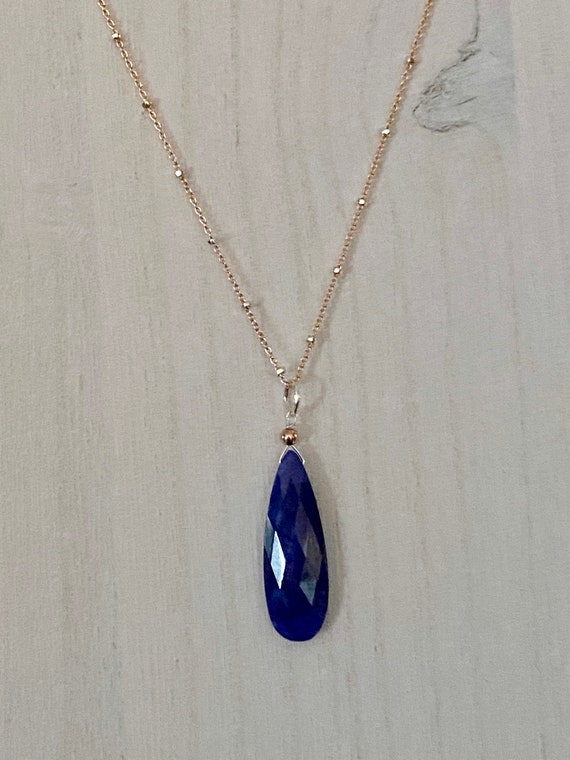 Beautiful Blue Sapphire pendant on a 18” rose gold and sterling silver satellite style chain.