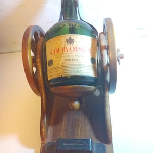 Antique Le Courvoisier Empty old Cognac bottle on wooden display