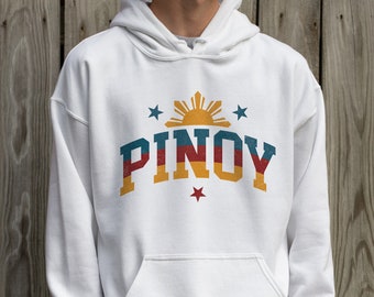 May include: White hooded sweatshirt with a vintage-style graphic of the Philippine flag and the word "PINOY" in red, yellow, and blue.