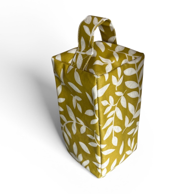 Tope de puerta con diseño de hoja en hule – Elegante accesorio para el hogar de tela en hule mate imagen 2