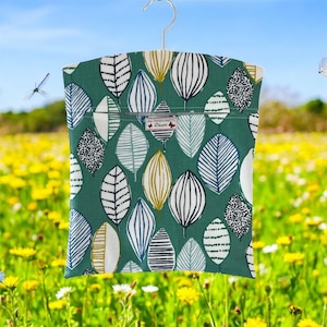 Oilcloth Peg Bag made in Graphic Line print in Leaf and Flower Matt Oilcloth Fabric green. Wipe clean surface. Clothes Pins Bag.