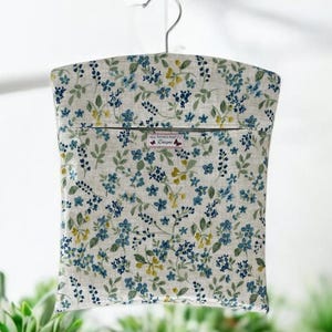 Oilcloth Peg Bag made in Meadow Flowers floral fabric. Denim colourway. Wipe clean. Housewarming Gift. Floral Peg Bag. Flower peg bag.