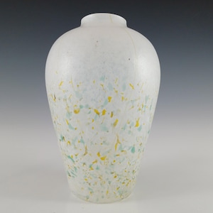 May include: White glass vase with a speckled pattern of yellow and green.