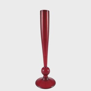 May include: A tall, ruby red glass vase with a flared base, a spherical midsection, and a slender, elongated neck. The vase stands approximately 30 cm tall, showcasing a classic, elegant design. The smooth, glossy finish reflects light.