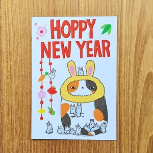 Cartolina del Capodanno lunare // Cartolina di buon anno del Capodanno cinese // gatto coniglio luppolo Capodanno