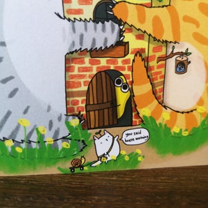 May include: A cartoon illustration of a housewarming party with a cat, a snail, and a yellow worm peeking out from behind a door. The text "you said house warming" is in a speech bubble.