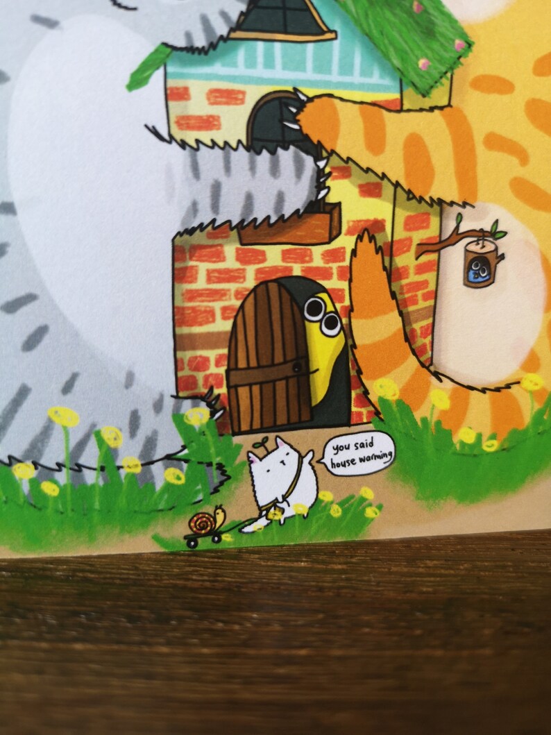 May include: A cartoon illustration of a housewarming party with a cat, a snail, and a yellow worm peeking out from behind a door. The text "you said house warming" is in a speech bubble.