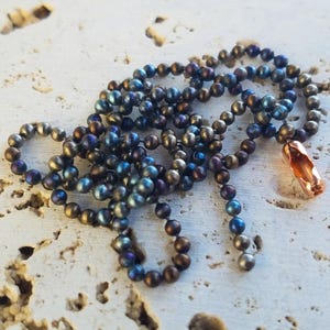 Correntes de contas de titânio TiSurvival