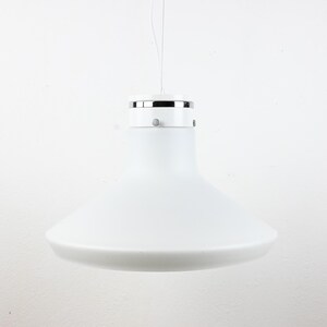 May include: A white, modern pendant light fixture. The light has a circular, chrome-colored top and a wide, conical shade. The shade is made of opaque white glass or plastic. The light hangs from a thin wire.