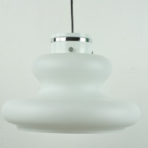 May include: A white pendant light with a frosted glass shade and a chrome top.