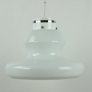 May include: A white glass pendant light with a chrome trim. The light has a rounded, bowl-shaped design.