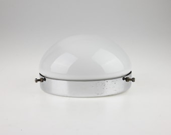 May include: A dome-shaped white glass light fixture shade with a polished chrome metal base. The circular metal band features two small protruding screws on opposite sides used for mounting the glass dome securely to the fixture frame.
