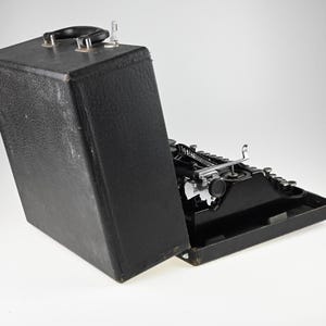 May include: A set of three ceramic mugs with a speckled, matte finish. The mugs are in shades of cream, light brown, and dark brown. Each mug has a simple, minimalist design, perfect for coffee or tea.