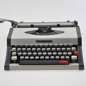 Máquina de escribir de lujo Brillant de 1970 con estuche, máquina de escribir portátil, máquina de escribir vintage, máquina de escribir gris, máquina de escribir manual, modernista