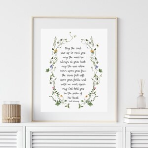 May include: A floral-framed printable with a poem about the road rising to meet you, the wind at your back, the sun shining warm on your face, and God holding you in the palm of His hand. The poem ends with "His blessing".