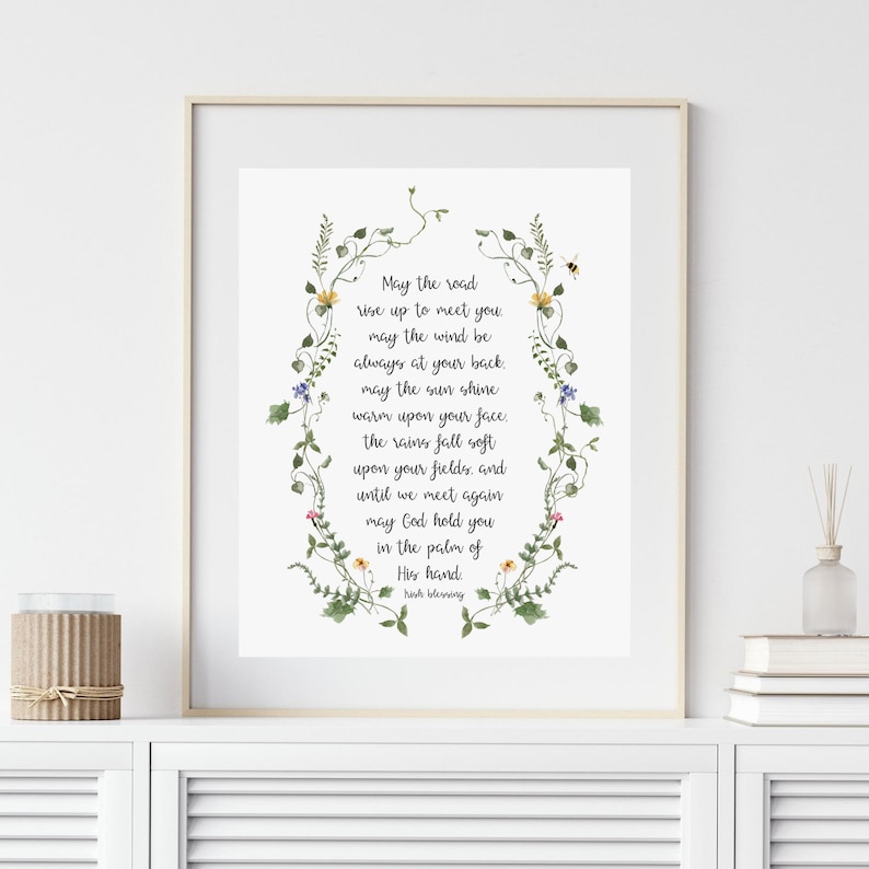May include: A floral-framed printable with a poem about the road rising to meet you, the wind at your back, the sun shining warm on your face, and God holding you in the palm of His hand. The poem ends with "His blessing".