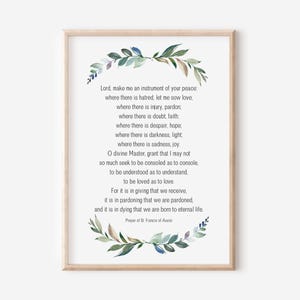 May include: A printable wall art print with a watercolor floral border and a quote from the Prayer of St. Francis of Assisi. The quote reads: "Lord, make me an instrument of your peace...and it is in dying that we are born to eternal life."