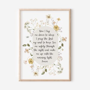 May include: A printable art print with a floral border and a white background. The text reads: "Now I lay me down to sleep. I pray the Lord my soul to keep. See me safely through the night and wake me up with the morning light. Amen."