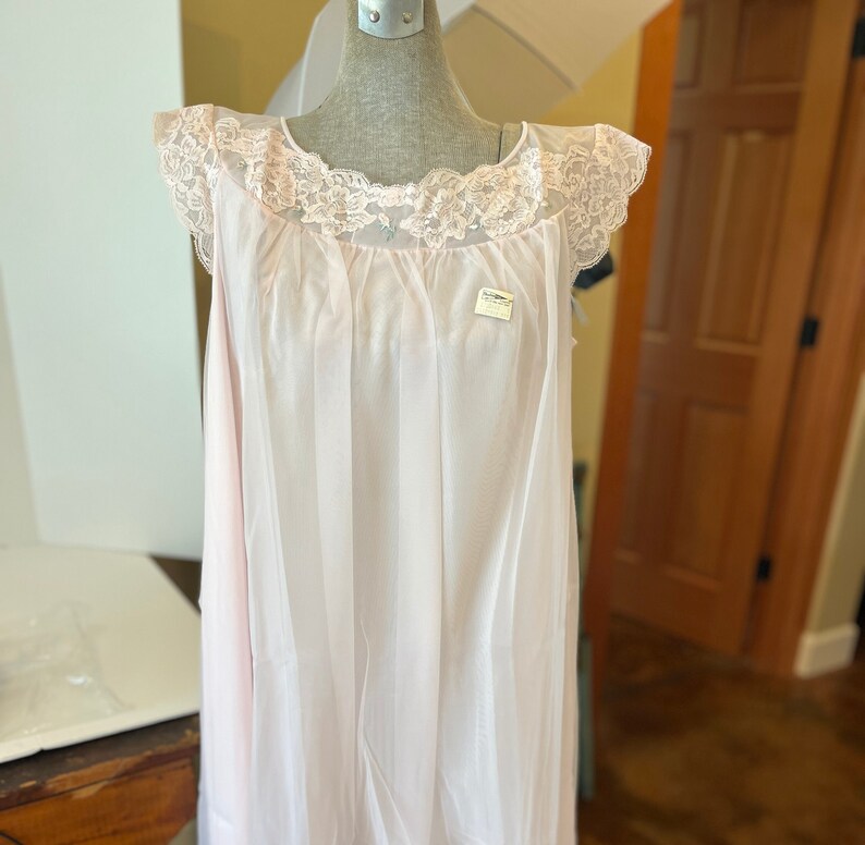 Vintage deadstock Shadowline lingerie nylon short nightgown in pink with lace trim.