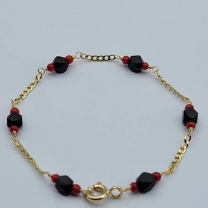 Pulsera de bebé de oro de 14 quilates: Azabache, coral, hecha a mano