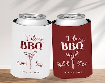 May include: Two can coolers, one white and one burgundy, with the text "I do BBQ" and personalized names and dates. The white cooler has "Laura Dean June 15 2026" printed on it. The burgundy cooler has "Rachel Chad May 30 2026" printed on it.